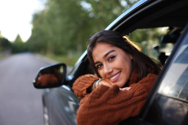 istock Woman sitting in a car 1644488120