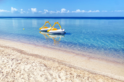 Empty coastline  with two catamarans in Halkidiki are waiting for tourists