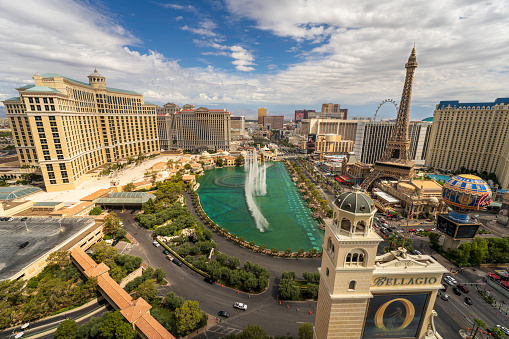 Las Vegas, Nevada, United States - August 10, 2023. Las Vegas skyline aerial panoramic view. A daytime cloudscape of the Nevada Strip with clouds over the famous Las Vegas Boulevard. This American city is a must see bucket list destination, a truly unique city that offers something for everyone. Whether you enjoy nature hiking and the national parks just off the Strip or you prefer pool parties and nightclubs. This desert oasis has it all.
