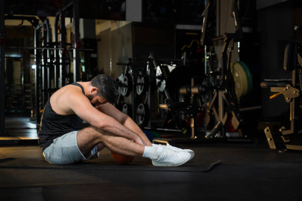 istock depress athletic caucasian man after practicing routine weightlifting and overtraining at modern gym 1644530246