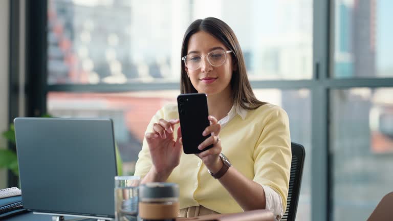 Laptop, networking and businesswoman with a phone in office browsing on social media or the internet. Technology, online and professional female lawyer working on computer and cellphone in workplace.