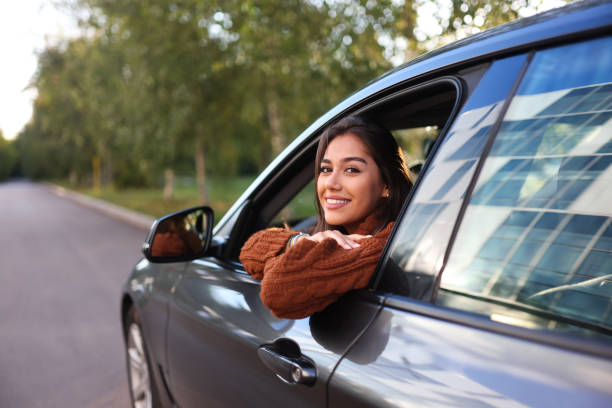 istock Woman sitting in a car 1644534023