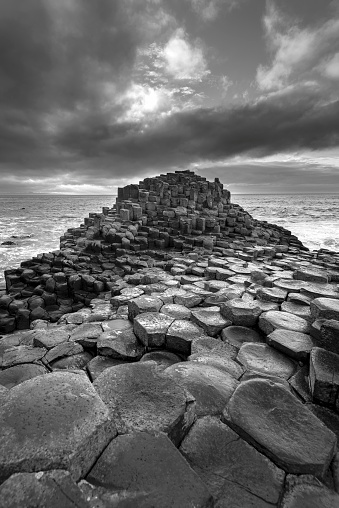 Basalt rocks and a rough sea at the Giants Causeway in Northern Ireland.
