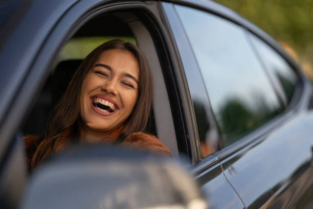 istock Beautiful woman in car 1644538557