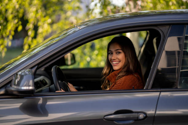istock Beautiful woman in car 1644540358