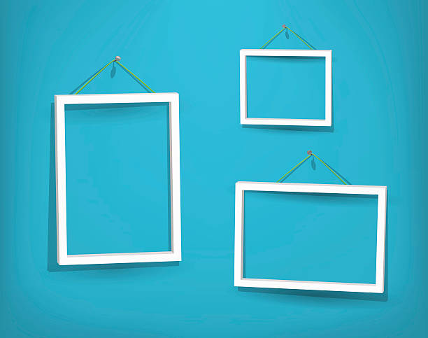 Three empty white frames on the wall Three empty frames of picture on the blue wall. Eps10. Used opacity layers for effect of shadows accent nails stock illustrations