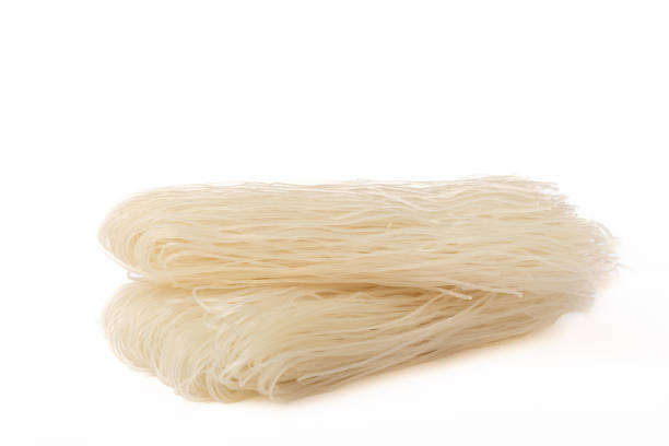 istock Dried raw rice noodles isolated on white background. 1644554858