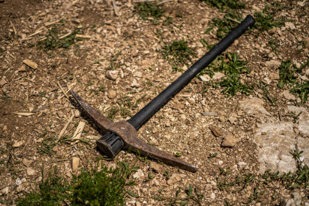 istock Pickaxe in the Dirt On Ground 1644557644