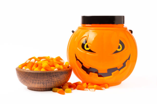istock Halloween candy jelly eye, pumpkin marshmallows, corn candy isolated on white background.Classic candy sweets for Halloween with.Halloween holiday concept with candy corn and jack o lantern. 1644560903