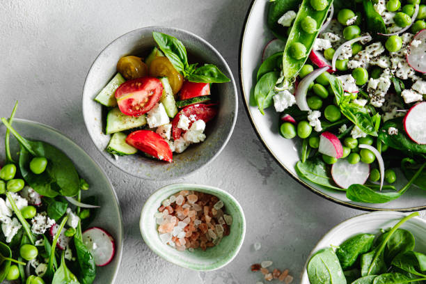 istock Table top view of a freshly made green salad on the kitchen table 1644565779