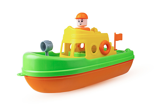 Children's toy ship with a captain isolated on white background. Clipping Path