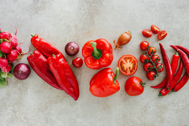 Directly above shot of fresh vegetables on white table
