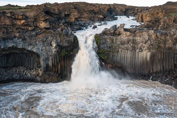 istock Powerful Aldeyjarfoss waterfall flowing from ancient Badardalshraun lava field and basalt column in summer at Iceland 1644567992