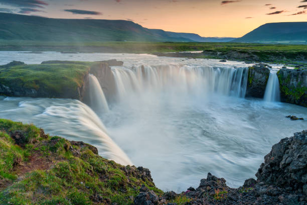 istock Sunset over Godafoss waterfall flowing in summer at Iceland 1644567997