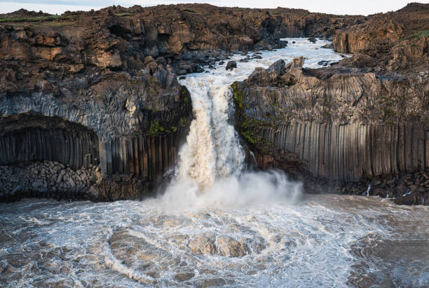istock Powerful Aldeyjarfoss waterfall flowing from ancient Badardalshraun lava field and basalt column in summer at Iceland 1644568001
