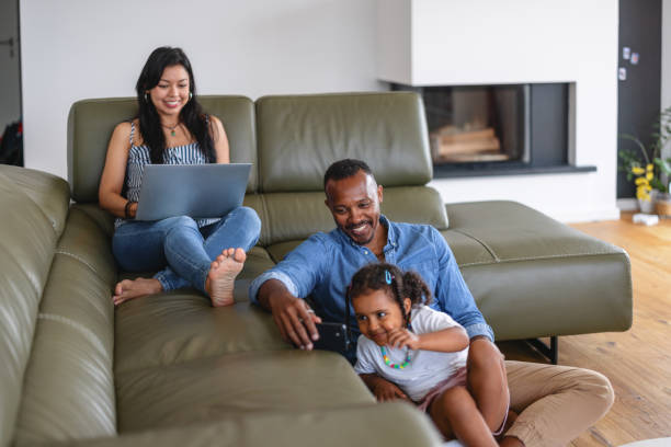 istock Cheerful Family Using Technology At Home 1644571895