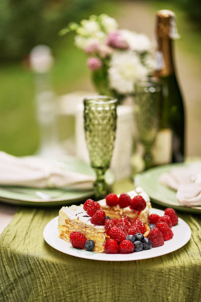 istock Festive table with wine, cake and fruit. Festive event. Romantic dinner. 1644577280