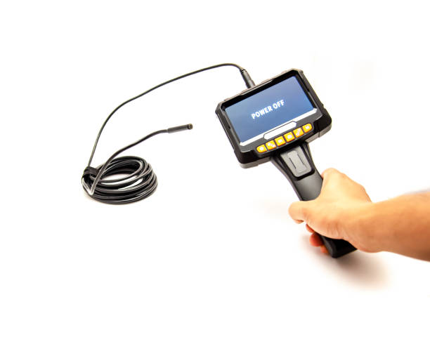 istock Working semi-rigid cable with LED lights attached to 5 inches IPS screen of endoscope camera in Asian man hand isolated on white background 1644588736