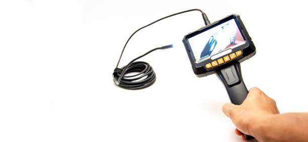 istock Panorama view working semi-rigid cable with LED lights attached to 5 inches IPS screen of endoscope camera in Asian man hand isolated on white background 1644589248