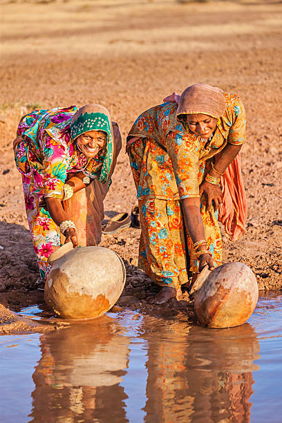 istock Indian women collecting water, Rajasthan 164459620