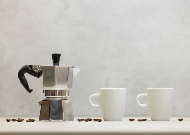 istock Metal geyser coffee maker on table with cup 1644596378