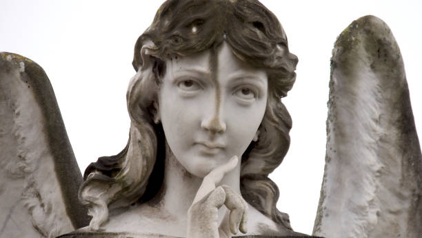 istock meditative angel statue detail 1644597992