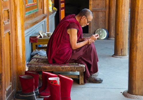 Xining, China- January 22, 2012: A Tibetan monk at Kumbum temple