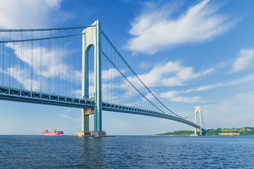 High resolution stitched image of the Verrazano-Narrows Bridge on a spring morning. The bridge connects boroughs of Brooklyn and Staten Island in New York City. The bridge was built in 1964 and is the largest suspension bridge in the USA. Historic Fort Wadsworth is next the bridge foot. Canon EOS 6D full frame censor camera. Canon EF 50mm f/1.8 II Prime Lens. 3:2 Image Aspect Ratio. The image was stitched from 2 rows of images. This image was downsized to 50MP. Original image resolution is 96MP or 12011 x 8007 px.
