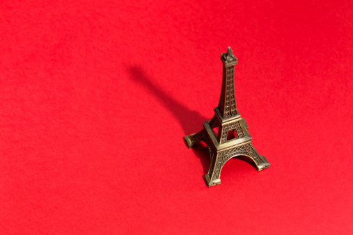 Eiffel Tower on red background. Selective focus