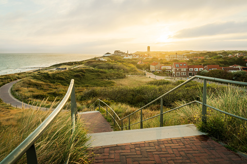 Coastline with a view over the dunes and the seaside resort of Domburg at sunset, Province Zeeland, Netherlands