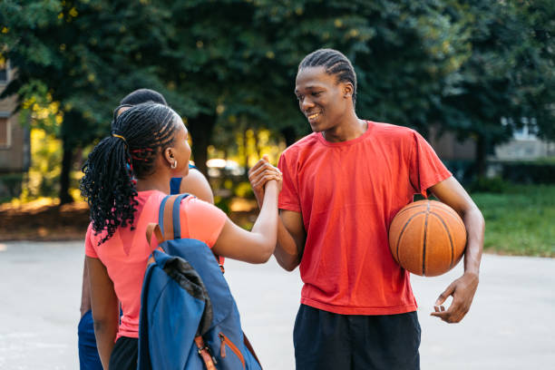 istock Friends Greeting After A Basketball Game 1644627612