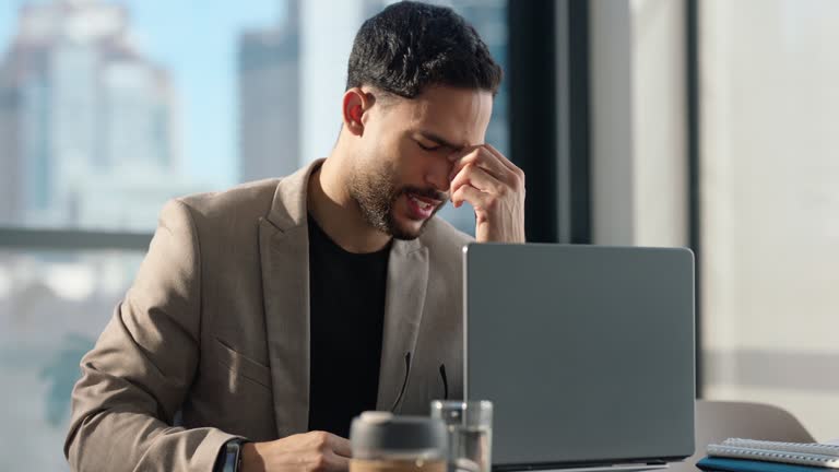 Laptop, stress and business man with headache in office from tax, audit or bad feedback, review or email. Glitch, 404 and angry designer with migraine, anxiety or problem, mistake or startup fail