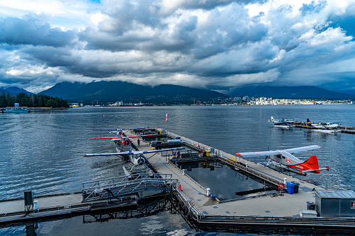 Vancouver, British Columbia - July 25, 2023: The view of Coal Harbour seaside park and Harbour Air Seaplanes, Vancouver, Canada.
