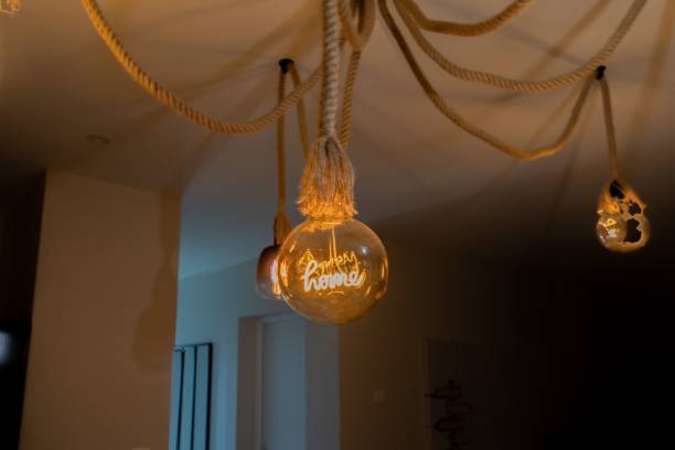 istock lights are suspended above in a room with no lights on 1644653159