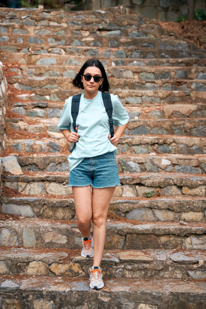 istock young woman goes down stairs down her way to university 1644661806