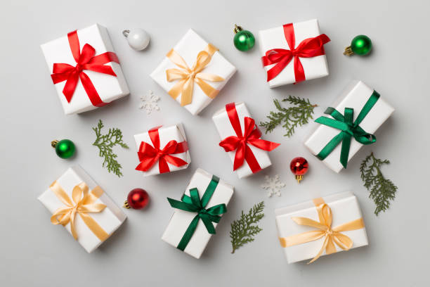 istock Gift boxes with decor on color background, top view 1644663060