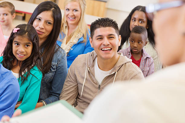 istock Parents and students attending school assembly or orientation 164466375