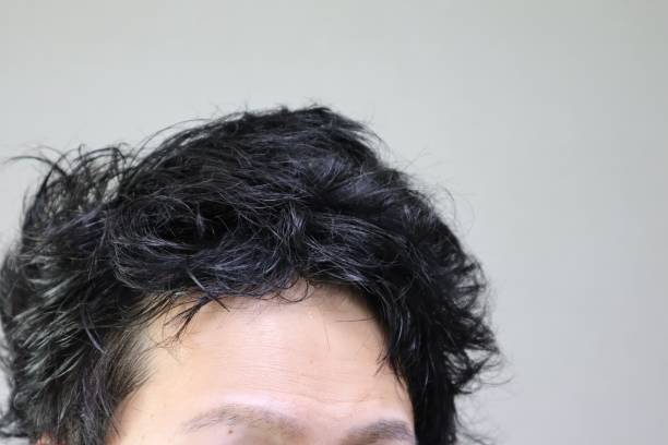 istock A Japanese man who covers thin hair with a hairstyle 1644693618