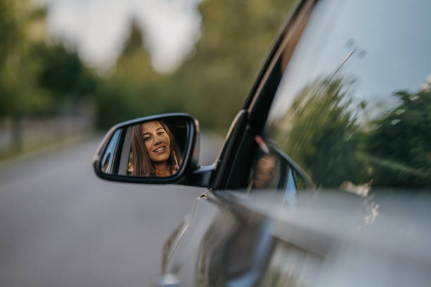istock Beautiful woman looking in mirror 1644695179