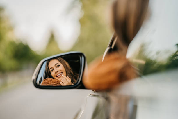 Beautiful woman looking in mirror