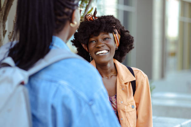 istock Two African American friends talking and laughing 1644703809