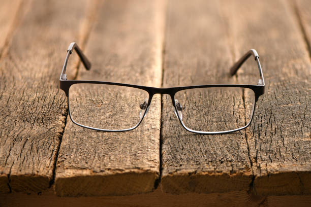Reading glasses and black hard case isolated on white background. High resolution photo.