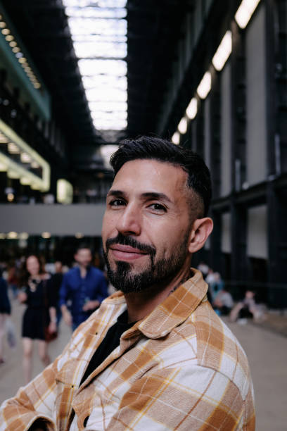 istock Portrait Young Man With Arms Crossed 1644708538