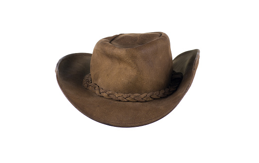 old crumpled leather cowboy hat isolated on white background