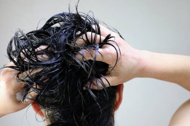 istock Back view of a man shampooing 1644737131