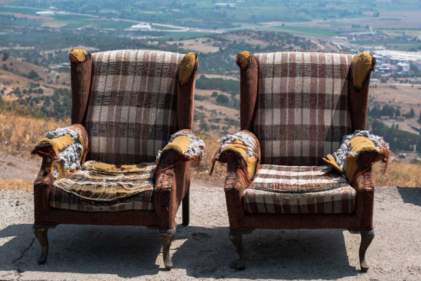 istock Dramatized front view of a pair of old armchairs. 1644757127
