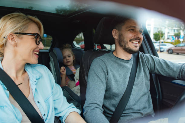 A Happy Family Going On Vacation By Car