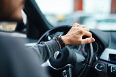 An Unrecognizable Businessman Driving His Car