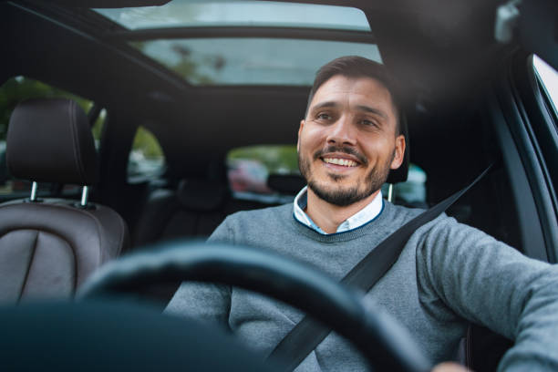 istock A Happy Handsome Businessman Driving His Car 1644775775