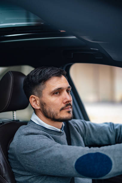 istock A Happy Handsome Businessman Driving His Car 1644775779